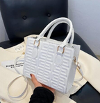 Quilted square box bag in pebbled vegan leather with greek key pattern
