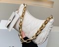 Quilted hobo bag in cream vegan leather with chunky gold chain handle