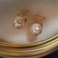 Pearl drop earrings with thin gold cross detail and cubic zirconia