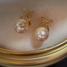 Pearl drop earrings with thin gold cross detail and cubic zirconia