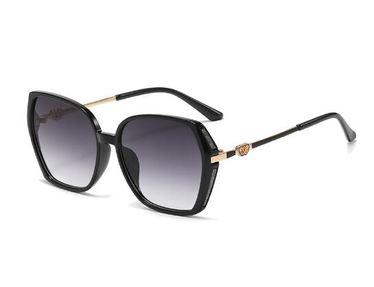 Oversized square sunglasses in black acetate with gold medallion detail