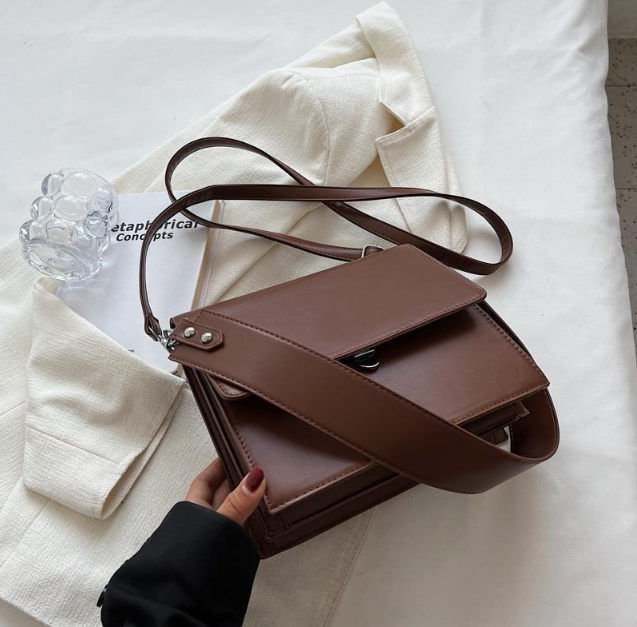 Structured mini bag in brown pebbled vegan leather, front view