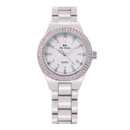 Gold tone watch with crystal bezel and link bracelet on wrist, view 3