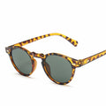 Round tortoise acetate sunglasses with green polarized lenses